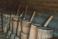 Old mortars with pistils in them. Old home utensils for grains grinding