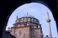 Old mosque in Istanbul, Turkey. Exterior view of the main dome and minarets, taken from the entrance archway.