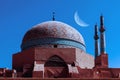 Old mosque in Yazd city against night sky with moon. Iran. Ancient Persia.