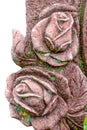 Old mossy stone granite rose. Part of tombstone in public cemetery of stone rose Royalty Free Stock Photo