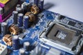The old motherboard from the PC. Blue color. Dust. Repair of the computer. Modern technologies. Workshop. Royalty Free Stock Photo
