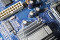 The old motherboard from the personal computer and its volume details. Dust. Repair of the computer. Modern technologies. Royalty Free Stock Photo