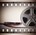 Old motion picture film reel with film strip Royalty Free Stock Photo