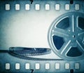 Old motion picture film reel with film strip. Royalty Free Stock Photo