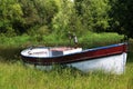 Old motor boat on the river in summer. Royalty Free Stock Photo