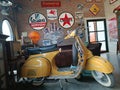old motorcycle brands Yellow Vespa. setting up a cafe.