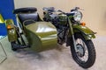 Old motorcycle with sidecar, restored, is standing indoors. Illustrative editorial: Ufa, Russia - April 2, 2019