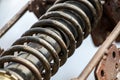 Old motorcycle spring suspension, close-up, visible rust and erosion of metal
