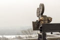 An old movie camera, against a sky background consisting of a tr Royalty Free Stock Photo