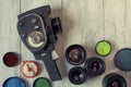 Old movie camera and several lenses Royalty Free Stock Photo