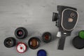 Old movie camera and several lenses Royalty Free Stock Photo