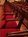 Old Movie Theatre Empty with red wooden chairs Royalty Free Stock Photo