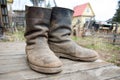 Old muddy farmers boots