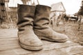Old muddy farmers boots