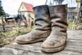 Old muddy farmers boots