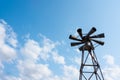 Old multidirectional emergency siren attached to a steel pylon