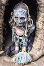 Old Mursi woman in her hut