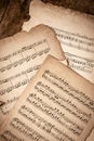 Old Music Sheets On Wooden Background Royalty Free Stock Photo