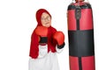 Old muslim woman wearing boxing gloves Royalty Free Stock Photo