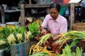 Old Myanmar woman selling vegetables