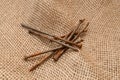 Old nails on the rough fabric.