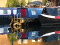 Narrow boats and barges converted to houseboats moored in the marina at brighouse basin in west yorkshire