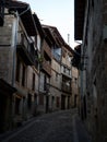 Old narrow cobblestone street lane alley in historical village town Frias Las Merindades Burgos Castile and Leon Spain Royalty Free Stock Photo