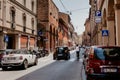 Old narrow street with arcade in Bologna, Emilia Romagna, Italy. Architecture and landmark of Bologna. Cityscape of Bologna.