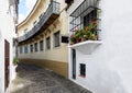 Old narrow street with beautiful balconies decorated with flower pots at traditional Spanish Village & x28;Poble Espanyol& x29; Royalty Free Stock Photo