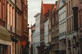 old narrow street with beautiful buildings in historic quarter of brugge, belgium Royalty Free Stock Photo