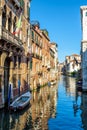 Old narrow street with a boat in Venice, Italy Royalty Free Stock Photo