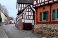 Old narrow street of the European city of Frankfurt, Bonames district, colorful houses, road, concept of history of architecture,