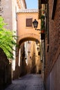 Old narrow street on the medieval city of Toledo in Spain Royalty Free Stock Photo