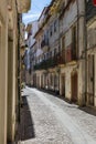 Old Narrow Street in Portuguese Town in a Sunny Day Royalty Free Stock Photo