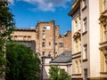 Old neglected building and newly restored building in Belgrade