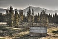 The old neglected house is in the high mountains