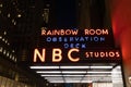 Old Neon Sign of the Rainbow Room Observation Deck and NBC Studios at Night in New York City Royalty Free Stock Photo