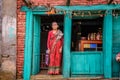 Old nepalese lady sells goods in her store