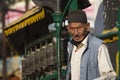 Old nepali man in front of buddhist prayer wheels in Nepal, Soyambunath temple, Kathmandu. Royalty Free Stock Photo