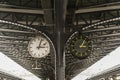 Old and new clock next to each other on the platform of the train station Royalty Free Stock Photo