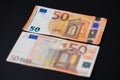 Old and new 50, fifty Euro banknotes on dark background. European monetary union. Design of Euro cash Banknotes. EU currency Euro Royalty Free Stock Photo