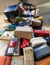 Dramatic image of stacked luggage in a luggage cart at sacramento international airport. Royalty Free Stock Photo