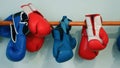 Old and new pairs of red and blue boxing gloves Royalty Free Stock Photo