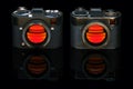 Old and new retro style digital camera isolated on black Royalty Free Stock Photo