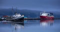 Old and new ships anchored in Beagle Channel waters in Ushuaia, Tierra del Fuego, Argentina