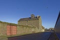 Old and new Warehouse Buildings on either side of the cobbled Erskine Road near to Montrose Port