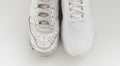 old and new white sneakers with laces on a white background. isolate.