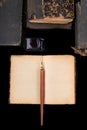 An old nib for writing in ink on a dark table. Antique calligraphy accessories