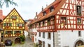 Old nice half-timbered houses in South Germany. Beautiful typical houses in German village. Panoramic view of vintage narrow Royalty Free Stock Photo