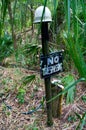 Old no trespassing sign in woods Royalty Free Stock Photo